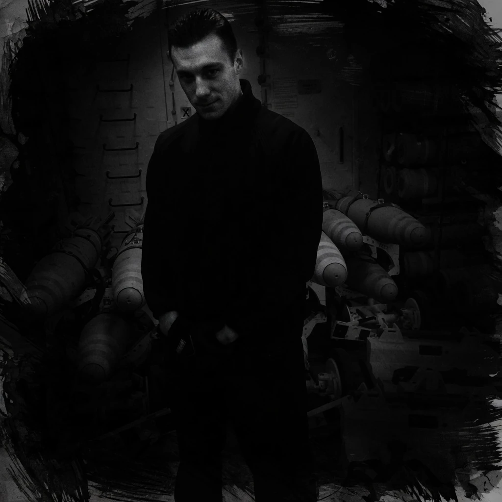 Chase Webb in the magazines aboard USS Iwo Jima, half-lost in ink